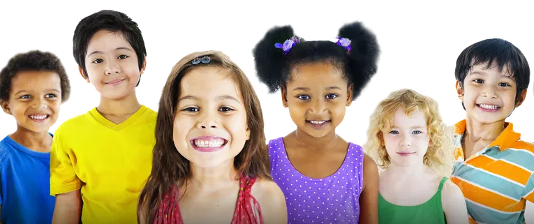 Six smiling children of different ages standing together