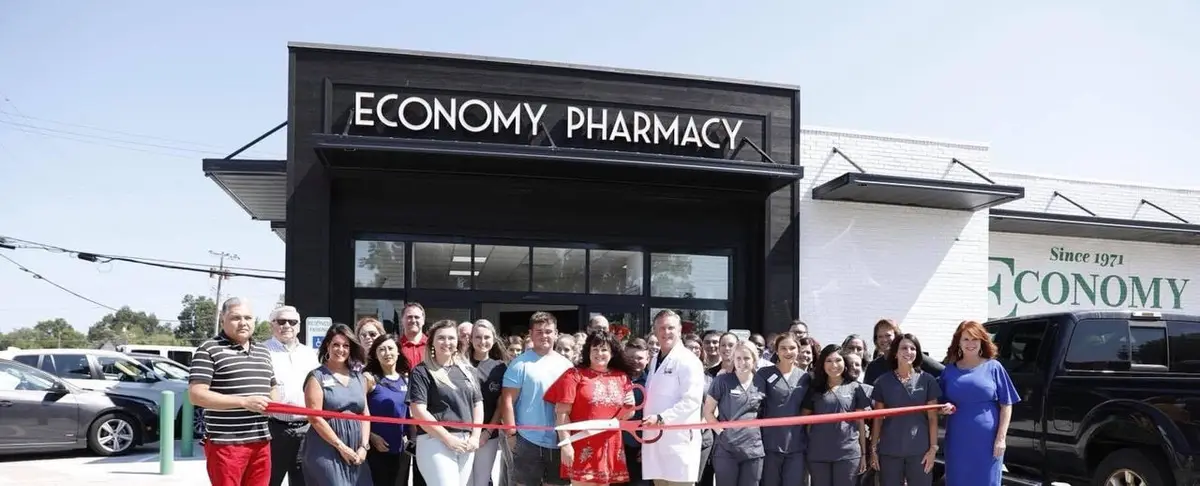 Ribbon cutting celebration outside Economy Pharmacy Muskogee Westside